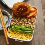 <span class="title">Monday bento lunch is ground chicken bowl with scrambled egg, potato croquette, stir fried nappa cabbage and pepper with curry .. #お弁当コンテスト</span>